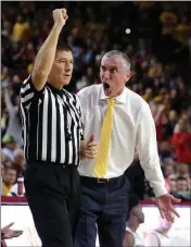  ?? ASSOCIATED PRESS ?? ARIZONA STATE COACH BOBBY HURLEY talks to official Tony Padilla during the first half of Thursday’s game in Tempe.