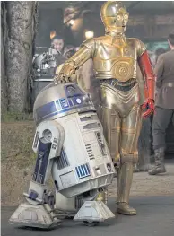  ??  ?? R2-D2, left, and Anthony Daniels as C-3PO, in The Force Awakens.