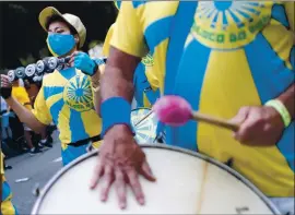  ??  ?? Carli Lowe and other members of Bloco Do Sol San Jose Brazilian percussion and dance perform at the San Jose Jazz Summer Fest on Friday.