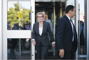  ?? SEAN KILPATRICK / THE CANADIAN PRESS ?? Ontario Premier Kathleen Wynne leaves the courthouse in Sudbury, Ont., after appearing as a witness on Wednesday in the Election Act bribery trial of two Ontario Liberal officials.