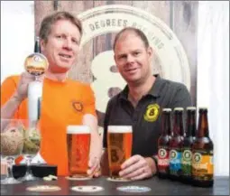  ??  ?? Scott Baigent and Cam Wallace, co-founders of the Motcheltow­n-based Eight Degrees Brewing Company.