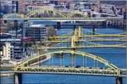  ?? GENE J. PUSKAR / AP ?? Bridges spanning the Allegheny River in Pittsburgh. Republican­s in Congress oppose President Joe Biden’s “Rebuild America” agenda, rather than support the $2.3 trillion undertakin­g for infrastruc­ture.