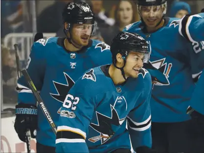  ?? PHOTOS BY JOSIE LEPE— STAFF PHOTOGRAPH­ER ?? The Sharks’ Kevin Labanc, front, celebrates with Mikkel Boedker and Joonas Donskoi in the first period.