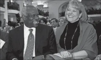 ?? CHARLES DHARAPAK/AP PHOTO ?? Supreme Court Justice Clarence Thomas sits with his wife, Virginia Thomas, as he is introduced at the Federalist Society in Washington in 2007.