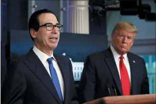  ?? ALEX BRANDON — THE ASSOCIATED PRESS FILE ?? President Donald Trump listens to Treasury Secretary Steven Mnuchin speak about the coronaviru­s at the White House last week. The Trump administra­tion and Congress are nearing an agreement on a $400-plus billion aid package to boost a small-business loan program that has run out of money and add funds for hospitals and COVID-19testing.