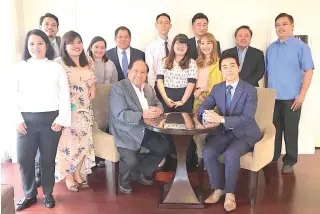  ??  ?? Tanifuji, founder of Asian Mergers Acquisitio­n (seated right) and Giovanni, Olivarez, president of Ecoverde Homes (seated left) with officials and personnel from both companies and from Japan real estate firm Kyushu Yaesa.