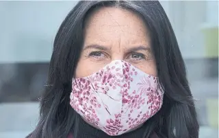  ?? PAUL CHIASSON THE CANADIAN PRESS FILE PHOTO ?? Montreal Mayor Valérie Plante wears a mask during a news conference. Canadians are growing more accustomed to wearing cloth face masks, but experts stress the need to properly sanitize them.