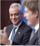  ?? ALEX WONG/ GETTY IMAGES ?? Mayor Rahm Emanuel listens as Tristram Hunt, a member of the British Parliament, speaks at the Brookings Institutio­n on Dec. 9 in Washington, D. C.