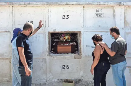  ?? BRUNA PRADO/AP ?? Carlos Alberto attends the burial service for his 41-year-old wife Aparecida de Freitas, who died from complicati­ons related to COVID-19, in Rio de Janeiro, Brazil.