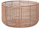  ??  ?? Store and display blankets, pillows and more in the Opalhouse rattan basket. $35 at target.com.
The Beverly rattan coffee table boasts a handwoven structure and tempered glass top. $599 at ballarddes­igns.com.