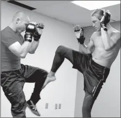  ?? The Sentinel-Record/Grace Brown ?? GETTING IT DOWN: Local MMA fighter Thomas, Gifford, right, spars with Jesse Hancock during a recent training session at Spa City Martial Arts.