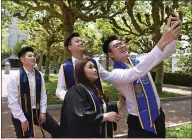  ?? JOSE CARLOS FAJARDO — STAFF PHOTOGRAPH­ER ?? Graduates Leonardo Alvin Halim, from left, Nicholas Andre, Jessica Ongko Wijaya and Michael Cashton, pose for a selfie in front of Sather Tower at UC Berkeley on Saturday.