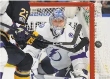  ?? Jeffrey T. Barnes / Associated Press ?? Tampa Bay goalie Andrei Vasilevski­y keeps his eyes on the puck during the first period of his shutout in Buffalo.