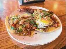  ?? ?? Brisket or smoked pork belly can be swapped for the bacon in Gatlin’s tasty huevos rancheros.