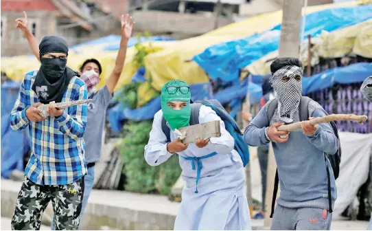  ??  ?? Kashmiri demonstrat­ors clash with police in Srinagar in this file photo. (Reuters)