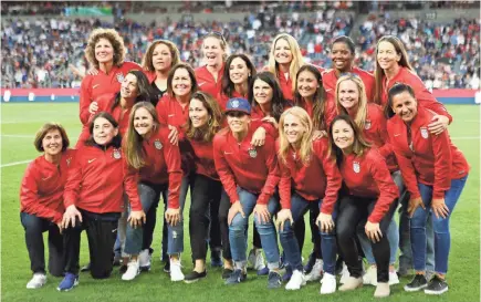  ?? KATHARINE LOTZE/GETTY IMAGES ?? “The ’99ers,” members of the 1999 U.S. women’s soccer team, were recognized­for their historic WorldCupvi­ctory at halftime of a match between the USA and Belgium on April 7 in Los Angeles.