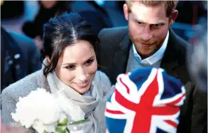  ??  ?? © REUTERS O casal do momento foi muito bem recebido por muitas pessoas em Brixton