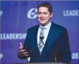  ?? The Canadian Press ?? Conservati­ve leadership candidate Andrew Scheer speaks to the crowd during the opening night of the federal Conservati­ve leadership convention in Toronto on Friday. A winner will be picked tonight.