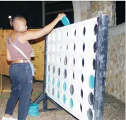  ?? ?? Sakhile Dlamini (L) and his sister Ntsandvose Dlamini battling it out in one of the games which were prepared for patrons. (R) MC OF THE NIGHT: Ndosh engaging patrons. (INSET) Itsallblaq taken by the rhythm during her stage appearance.