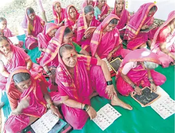  ??  ?? Twenty-nine grandmothe­rs aged between 55 and 90 years old are enrolled in the special school in Fagane in Maharashtr­a.