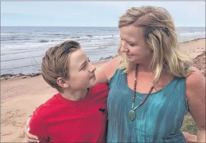  ?? SUBMITTED PHOTO ?? Beth Johnston and her son, Charlie Ross, are shown on the beach in Savage Harbour Monday where they had the fright of their lives Saturday evening after getting caught in a rip current.