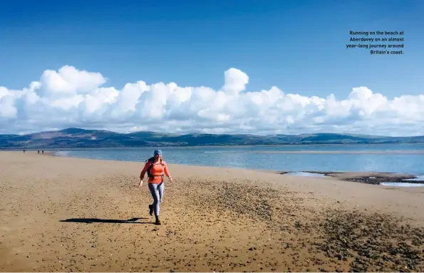  ??  ?? Running on the beach at Aberdovey on an almost year-long journey around Britain’s coast.