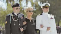  ?? AP PHOTOS ?? WITH SORROW: Cindy McCain, above with military escorts, presses her head, far left, against the casket of her husband, Sen. John McCain, in Phoenix yesterday.