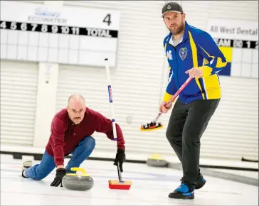  ?? @IMartensHe­rald Herald photo by Ian Martens ?? Herald sports reporter Dale Woodard delivers a shot with the help of the Lethbridge Curling Club’s Darren Moulding, who recently competed for Alberta at the Brier, during a media preview event ahead of hosting the 2017 World Mixed Doubles and World...