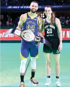  ?? — AFP photo ?? Curry and Ionescu pose for a photo after their 3-point challenge during the State Farm All-Star Saturday Night at Lucas Oil Stadium in Indianapol­is, Indiana.