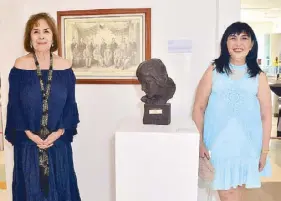  ??  ?? Daisy Tolentino Mendez, daughter of National Artist for Sculpture Guillermo Tolentino, beside her father’s “Babae” sculpture with SM SVP for marketing Millie Dizon