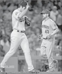  ?? Mark J. Terrill Associated Press ?? FORMER DODGER Scott Schebler circles the bases after his three-run homer against J.T. Chargois gave the Reds the lead.