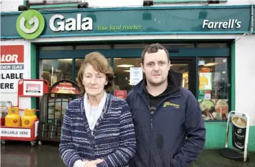  ??  ?? Concerned: Josephine Farrell with her son Gerry outside their shop in Lanesborou­gh