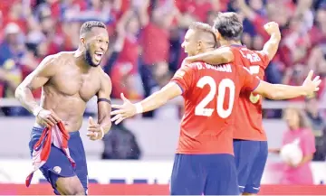  ??  ?? Costa Rica’s Kendall Waston (left) celebrates with teammates after scoring against Honduras during their 2018 World Cup qualifier football match, in San Jose on October 7, 2017. - AFP photo