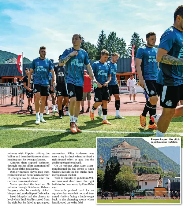  ?? ?? Players inspect the pitch in picturesqu­e Kufstein