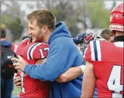  ?? DAVID JABLONSKI/STAFF ?? Ex-Flyers tight end Adam Trautman greets former teammate Zach Rumpke after UD scrimmaged Ashland on Saturday at Welcome Stadium.