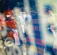  ?? Marie D. De Jesús/Staff photograph­er ?? CRECEN executive director Teodoro Aguiluz, center, rallies in 2021 at the Harris County Democratic Party offices.