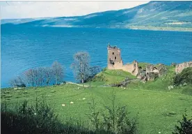  ?? ANONYMOUS THE ASSOCIATED PRESS ?? This file photo shows part of Scotland's 37-kilometre-long Loch Ness, home of the elusive monster, Nessie. In foreground is Urquhart Castle.