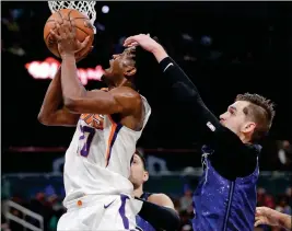  ?? ASSOCIATED PRESS ?? PHOENIX SUNS’ JOSH JACKSON, left, is fouled by Orlando Magic’s Mario Hezonja as he goes up for a shot during the second half of an NBA game, Saturday in Orlando, Fla.
UP NEXT