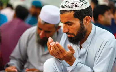  ?? SHIHAB / KHALEEJ TIMES ?? Faithful pray after iftar at a mosque in Dubai.