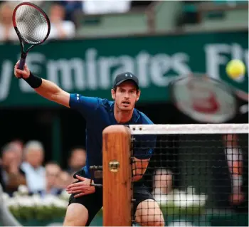  ?? (Photo by Christophe Ena, AP) ?? Britain’s Andy Murray, left, eyes the ball as Argentina’s Juan Martin del Potro volleys during their third round match of the French Open tennis tournament on Saturday.