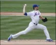  ?? KATHY WILLENS - THE ASSOCIATED PRESS ?? New York Mets starting pitcher Jacob deGrom winds up during the first inning of a baseball game against the Miami Marlins at Citi Field, Sunday, Aug. 9, 2020, in New York.