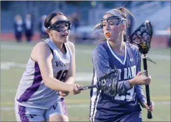  ?? File photo ?? West Ranch’s Sammy Nuchow (29) is guarded by Valencia’s Mia Lopez (16) at Valencia earlier this season. Nuchow is competing in the U.S. Lacrosse Women’s National Tournament this weekend.