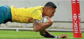  ?? PHOTO: GETTY IMAGES ?? Israel Folau dives to score his second try during the Wallabies’ win.