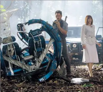  ?? Chuck Zlotnick Universal Pictures and Amblin Entertainm­ent ?? “JURASSIC WORLD” is among an unusually strong slate of movies from bankable franchises scheduled to hit theaters this year. Above, Chris Pratt and Bryce Dallas Howard in a scene from the film.