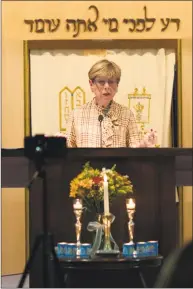  ?? Trish Haldin / For Hearst Connecticu­t Media ?? Susi Leiter, a Holocaust survivor who lives in Sherman, shares her childhood memories from Berlin during a Kristallna­cht commemorat­ion at Temple Sholom in New Milford on Friday. Friday night marks the 80th anniversar­y of Kristallna­cht.