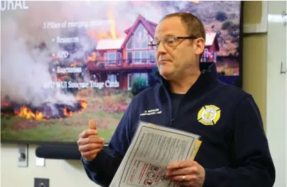  ?? ?? Firefighte­r Jason Kohler leads a class Monday, April 24, 2023, teaching other firefighte­rs in Anchorage, Alaska, how to fight wildland fires. Photo AP/Mark Thiessen.