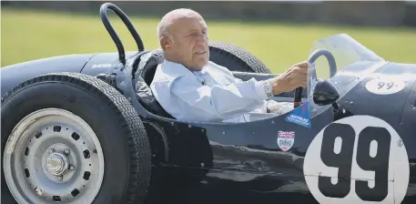  ??  ?? Sir Stirling Moss driving an historic Grand Prix car after taking part in the Goodwood Festival of Speed in 2011. Picture PA Wire