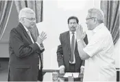  ?? SRI LANKAN PRESIDENT’S OFFICE VIA AP ?? Ranil Wickremesi­nghe (left) is sworn in Thursday by Sri Lankan President Gotabaya Rajapaksa.