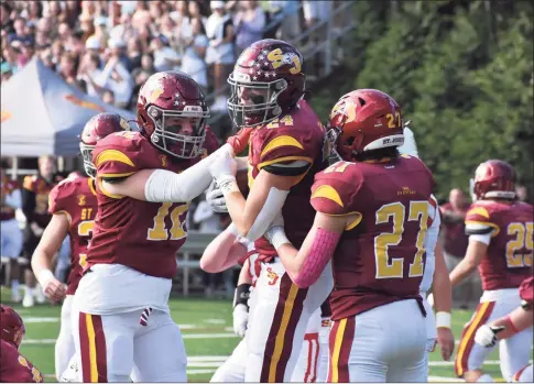  ?? Pete Paguaga / Hearst Connecticu­t ?? St. Joseph’s Tyler DaSilva celebrates with teammates after scoring a touchdown against Greenwich on Saturday in Trumbull.