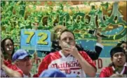  ?? BEBETO MATTHEWS — THE ASSOCIATED PRESS ?? Joey Chestnut wins the Nathan’s Annual Famous Internatio­nal Hot Dog Eating Contest, marking his 10th victory in the event Tuesday in New York.